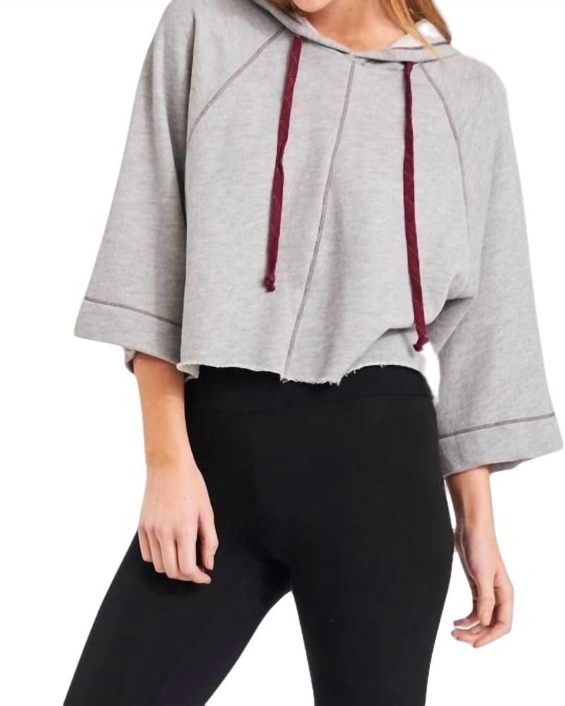 Front of a model wearing a size L Vonn Crop Hoodie in Heather Grey in Heather Grey by LAmade. | dia_product_style_image_id:343579
